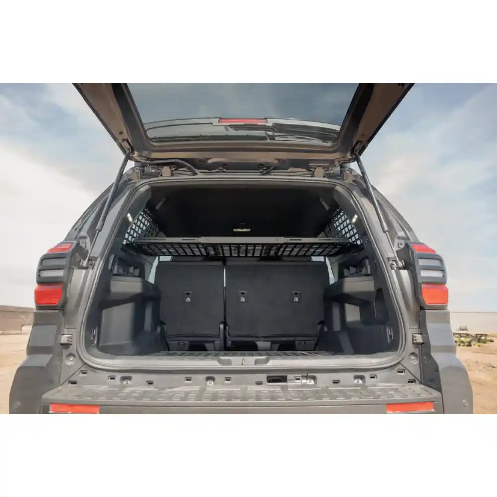 2025 4Runner with rear hatch open showing Rago storage shelf outdoors