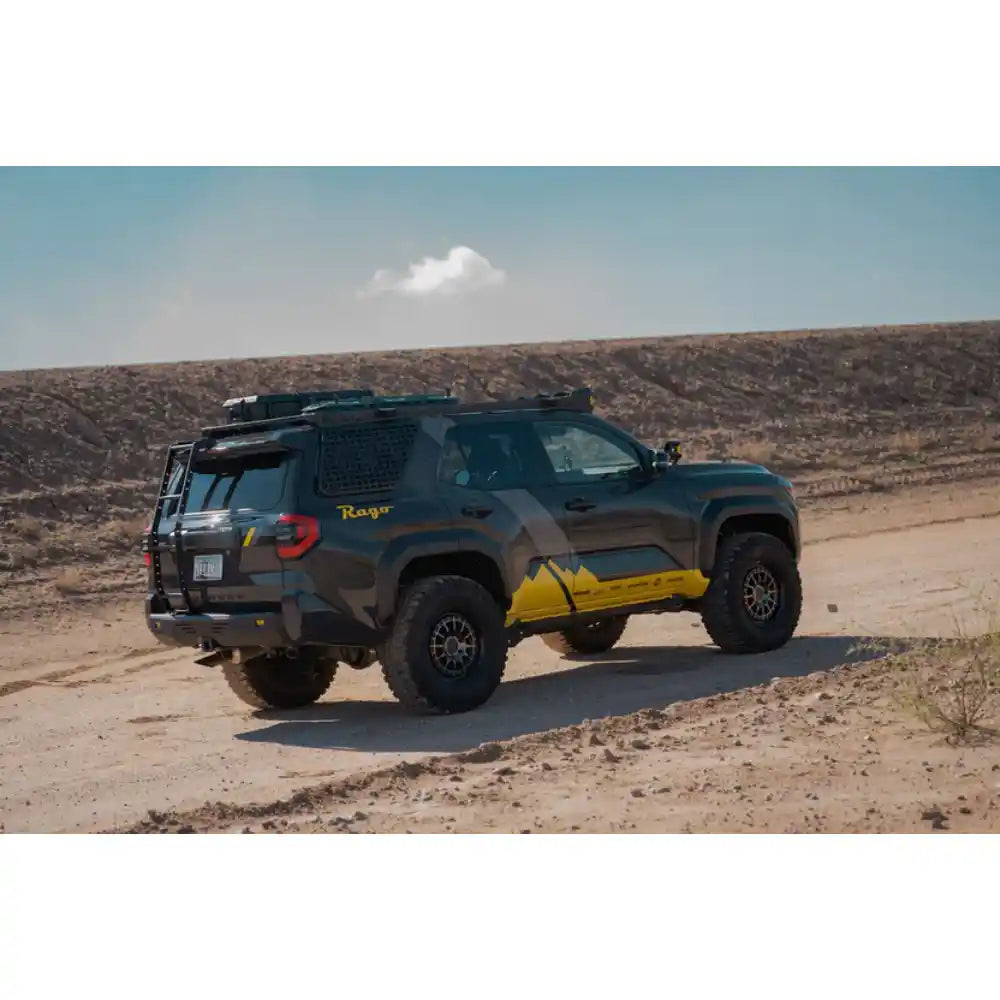 2025 4Runner with Rago hatch ladder driving off-road, rear three-quarter