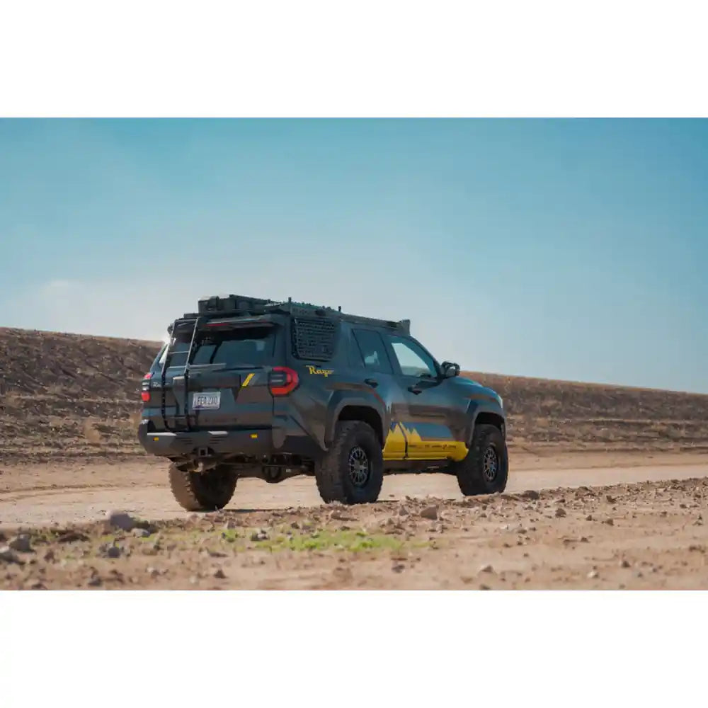 Toyota 4Runner with Rago hatch ladder and roof rack on trail