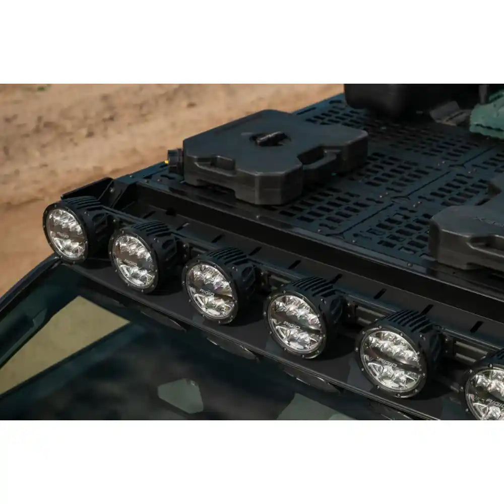 Rago 4Runner roof rack with round pod lights and gear, top front view