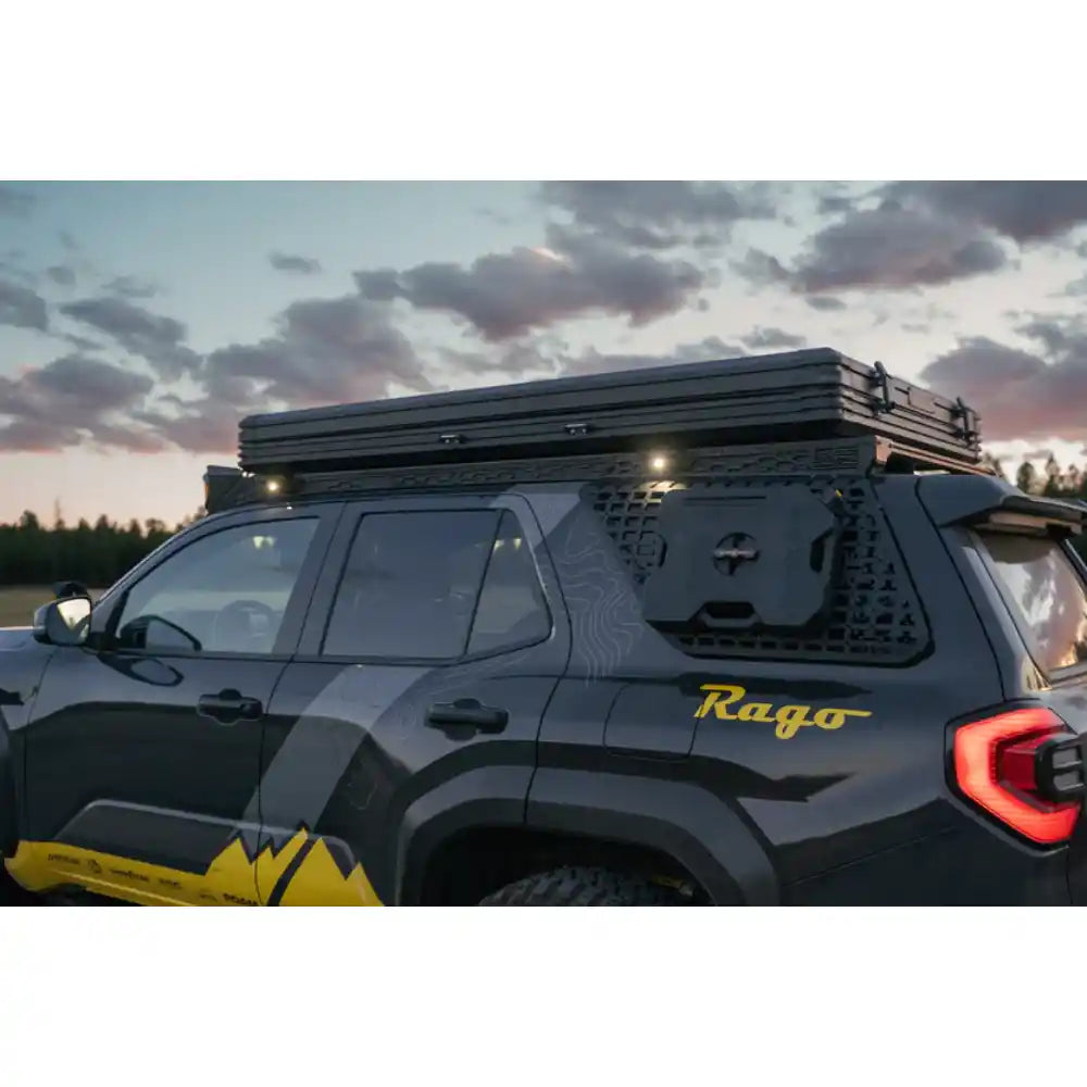 6th Gen 4Runner with Rago roof rack and rooftop tent, rear three-quarter at dusk