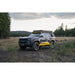 Toyota 4Runner with rooftop tent on Rago roof rack, front three-quarter in forest