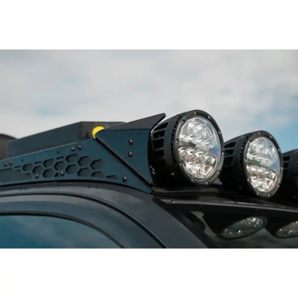 Round off-road lights on Rago roof rack front fairing, close-up