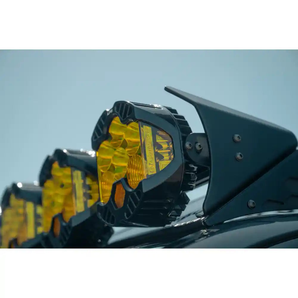 Baja Designs LP6 lights on Rago roof rack mount, side close-up