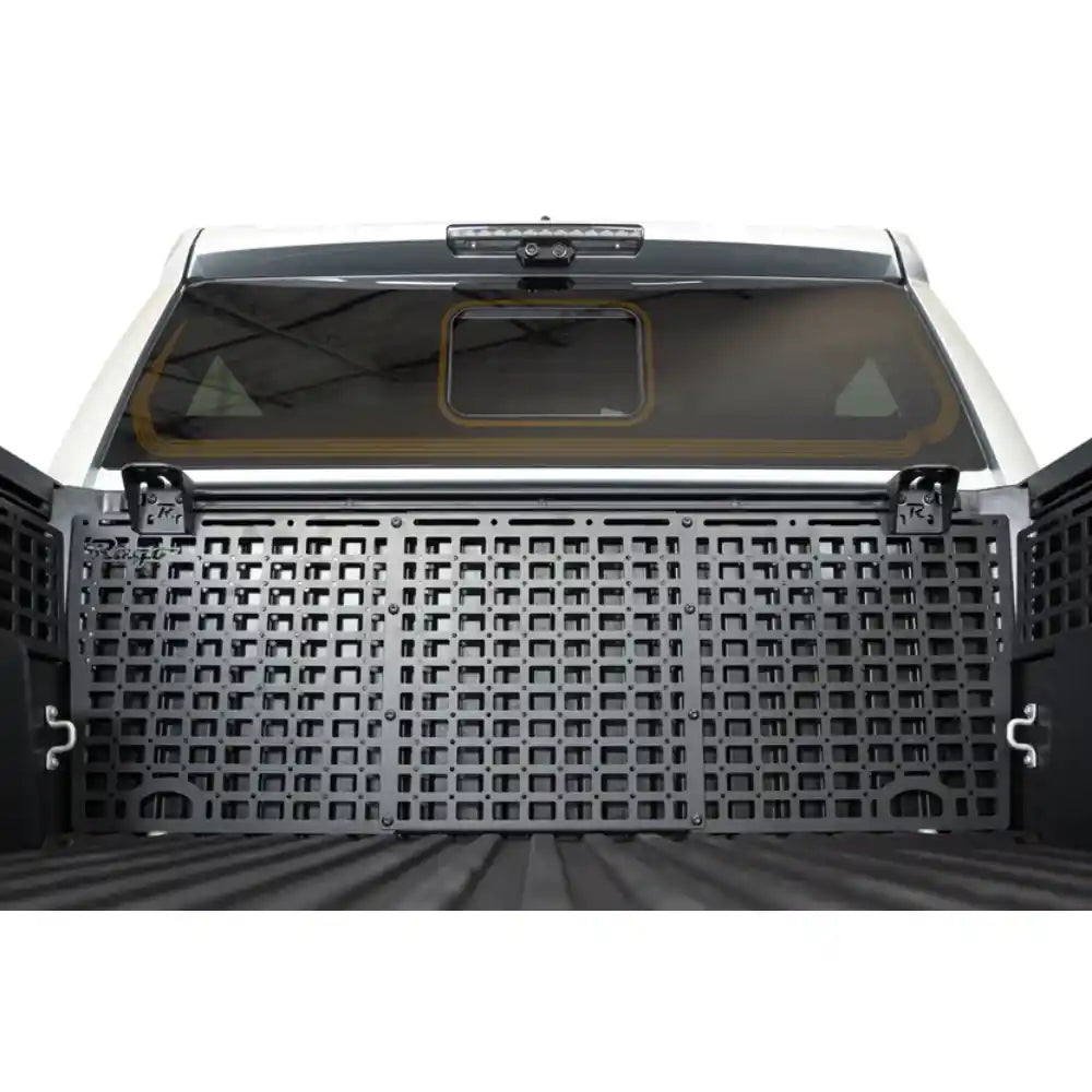Rago accessory brackets on Toyota front bed rail with Molle panel