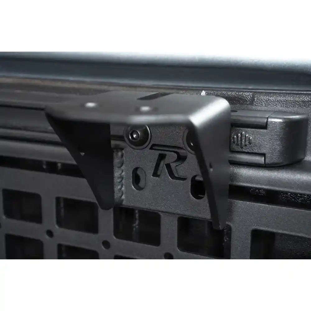 Rago accessory mounting bracket on Toyota bed rail, angle view