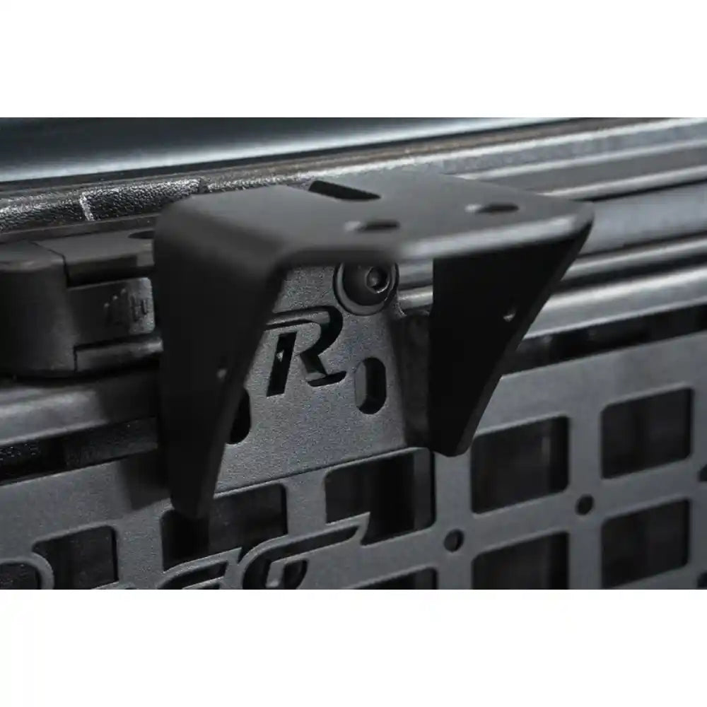 Rago accessory mounting bracket on Toyota bed rail with Molle panel, close-up