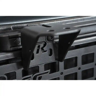 Rago accessory mounting bracket on Toyota bed rail with Molle panel, close-up