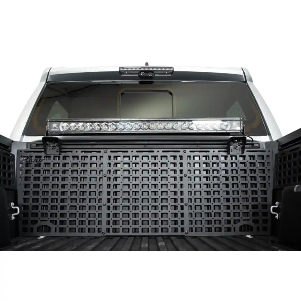 Light bar mounted on Rago bed rail brackets in Toyota Tacoma bed
