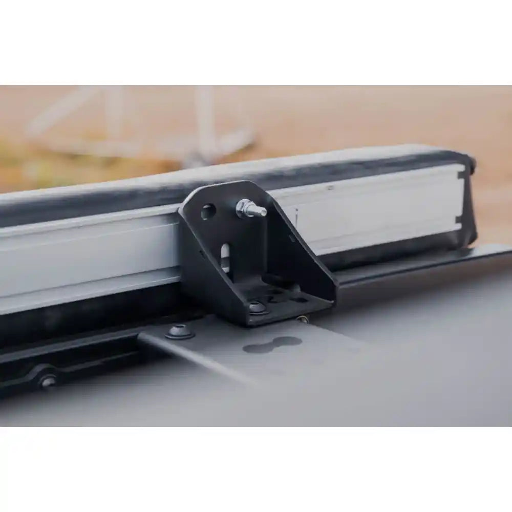 Rago crossmember mount on factory roof rail, close-up