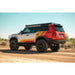 Toyota Land Cruiser in desert with Rago exterior Molle panels, front angle