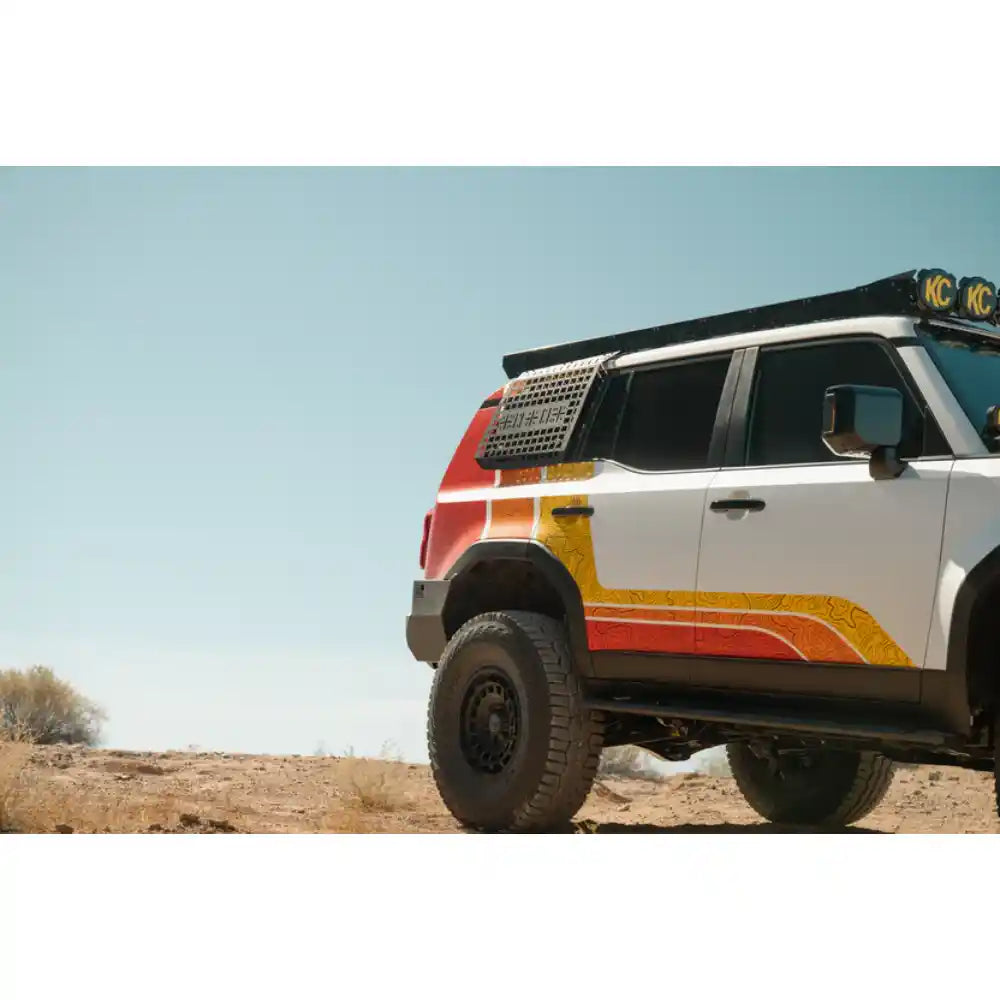 Toyota Land Cruiser off-road with Rago exterior Molle panels, front three-quarter