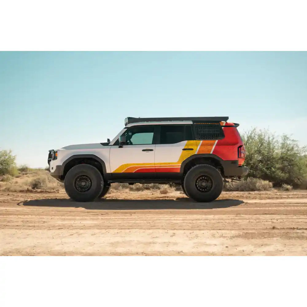 Toyota Land Cruiser with Rago exterior Molle panels, side profile in desert