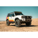 Land Cruiser with KC HiLites on Rago roof rack, front three-quarter