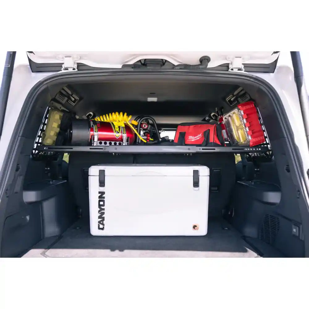Land Cruiser cargo with gear below Rago storage shelf