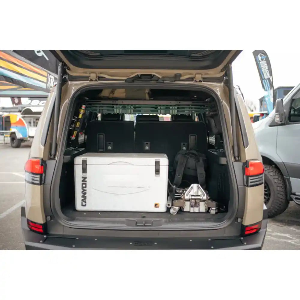 Lexus GX 550 with fridge below Rago storage shelf