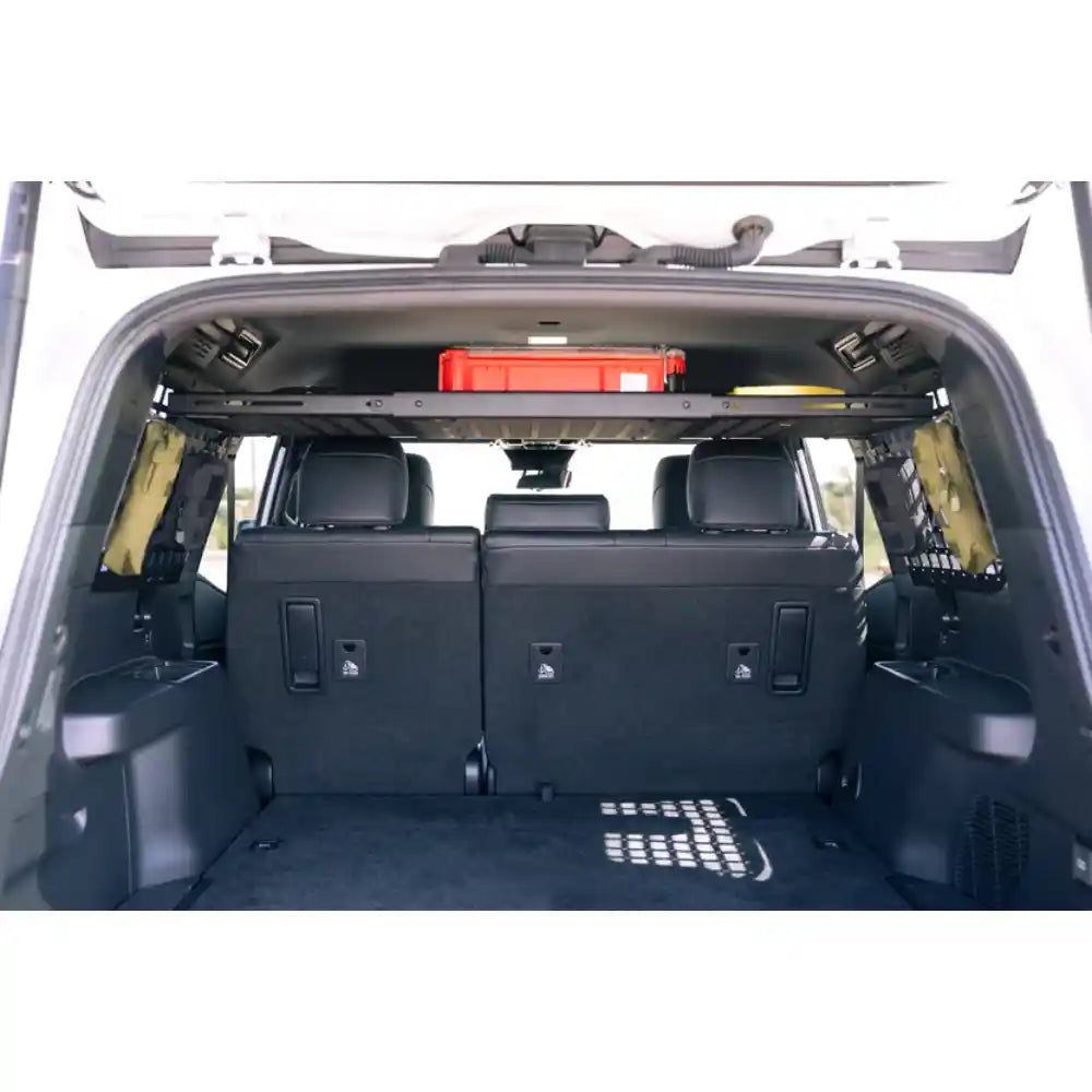 Land Cruiser cargo area with Rago storage shelf, rear view
