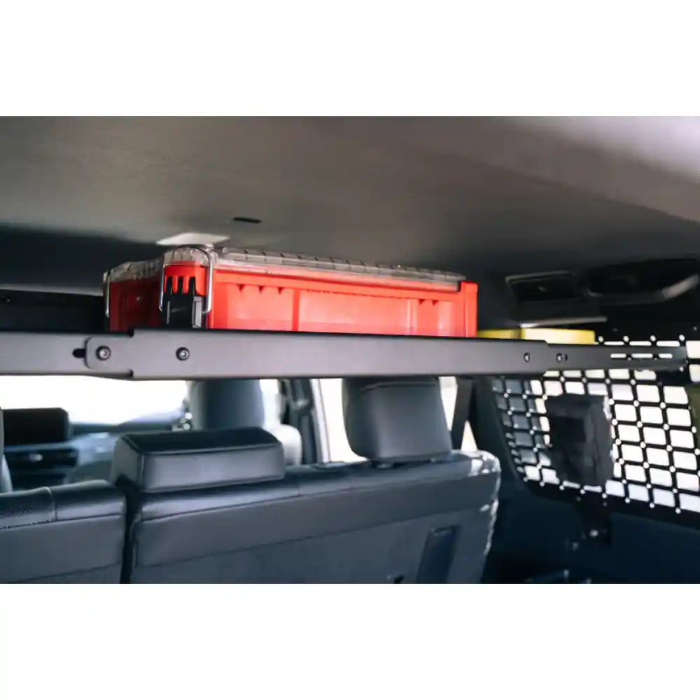 Rago storage shelf with red gear in Land Cruiser