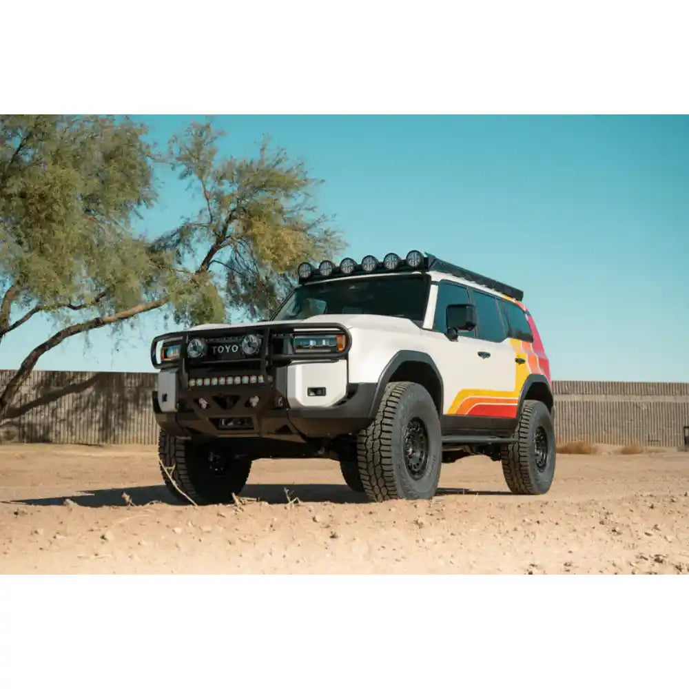 Land Cruiser with RIGID lights on Rago roof rack, front three-quarter