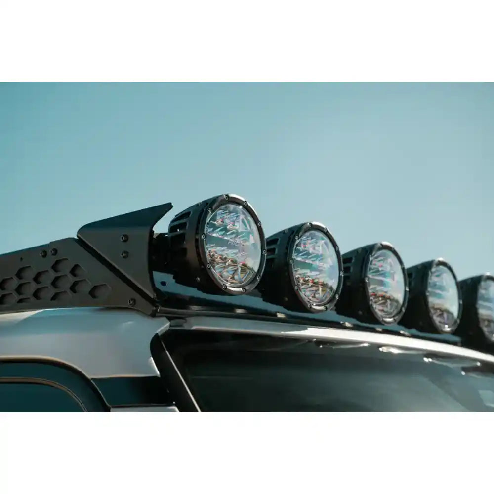 Six RIGID round lights on Rago roof rack, side close-up