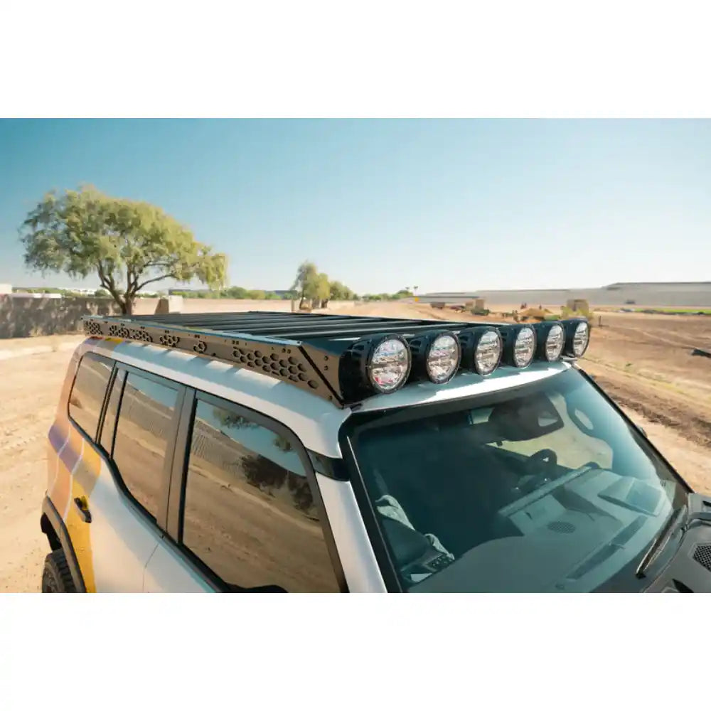 RIGID round lights on Rago roof rack above Land Cruiser windshield