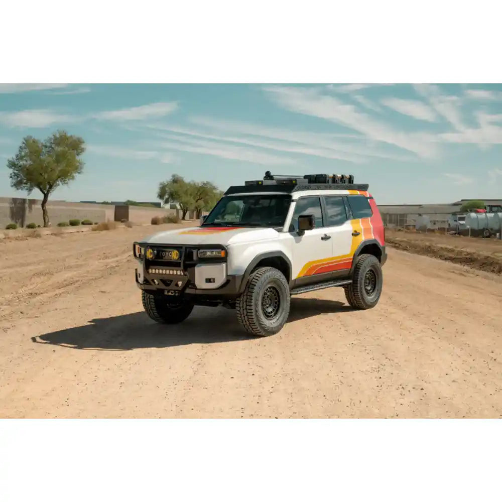 2024 Land Cruiser with Rago roof rack, front three-quarter in desert