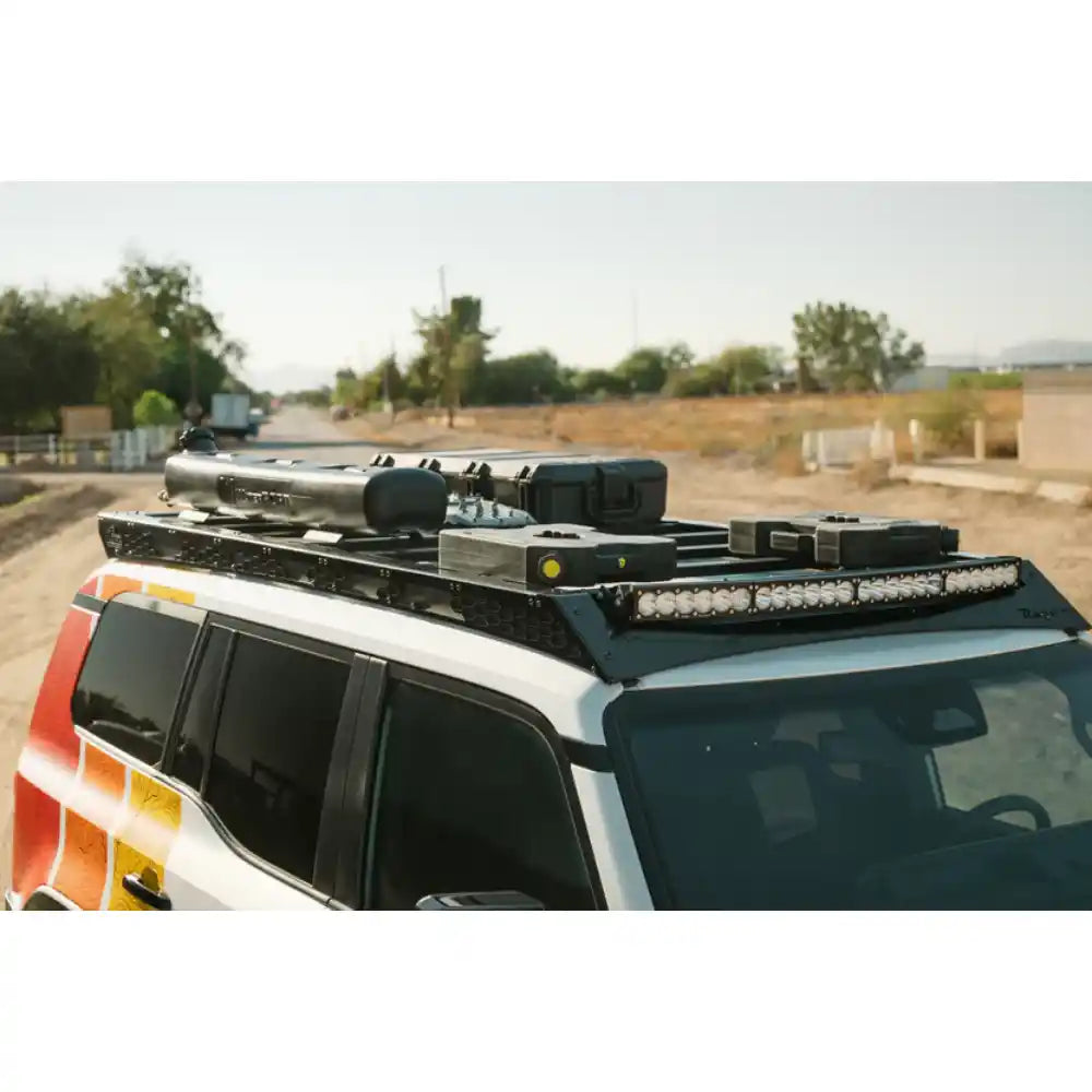 Rago roof rack loaded with gear on Land Cruiser, elevated angle