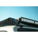 Light bar in Rago roof rack pocket against sky, close-up