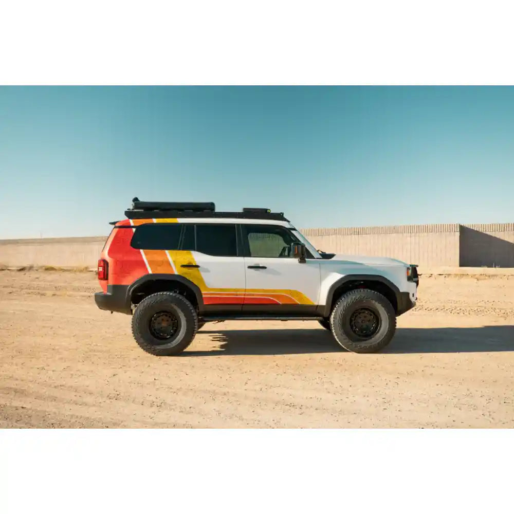 2024 Land Cruiser with Rago light pocket roof rack in desert, side view