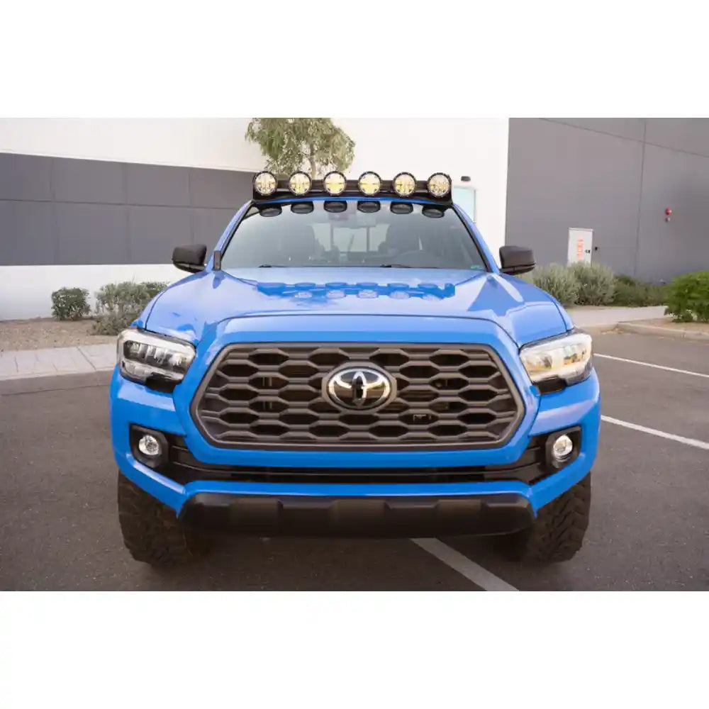 Blue 3rd Gen Tacoma with Rago round light mount, front view
