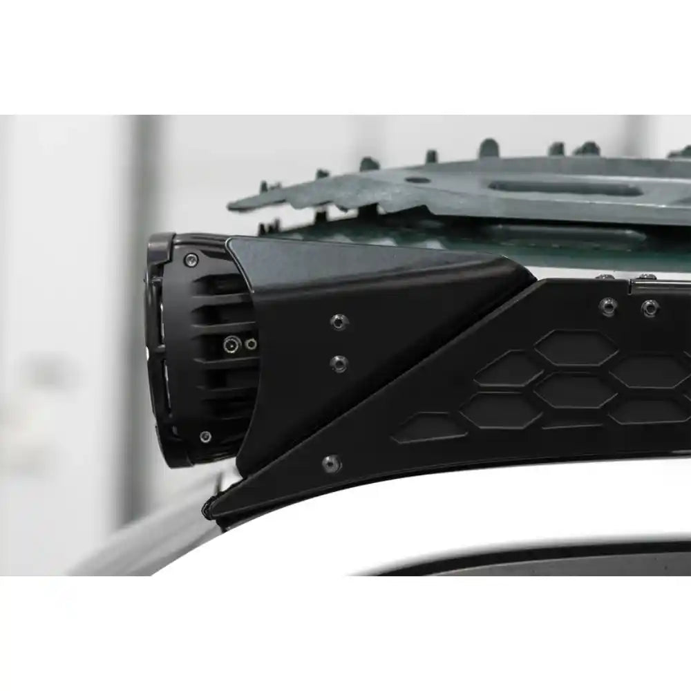 Rago round light mount bracket on roof rack fairing, side detail
