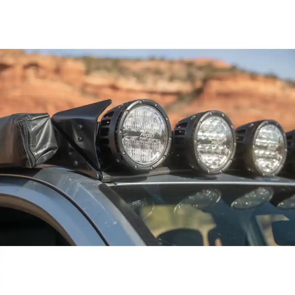 Six RIGID round lights on Rago roof rack mount, close-up