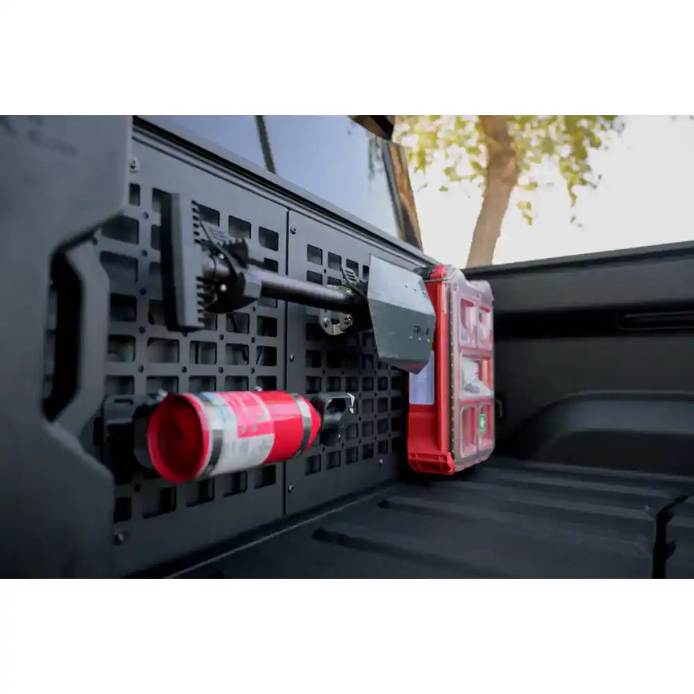 Rago Rivian R1T bed cab Molle panel with fire extinguisher, close-up