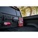 Rago Rivian bed cab Molle panel with fire extinguisher, side view