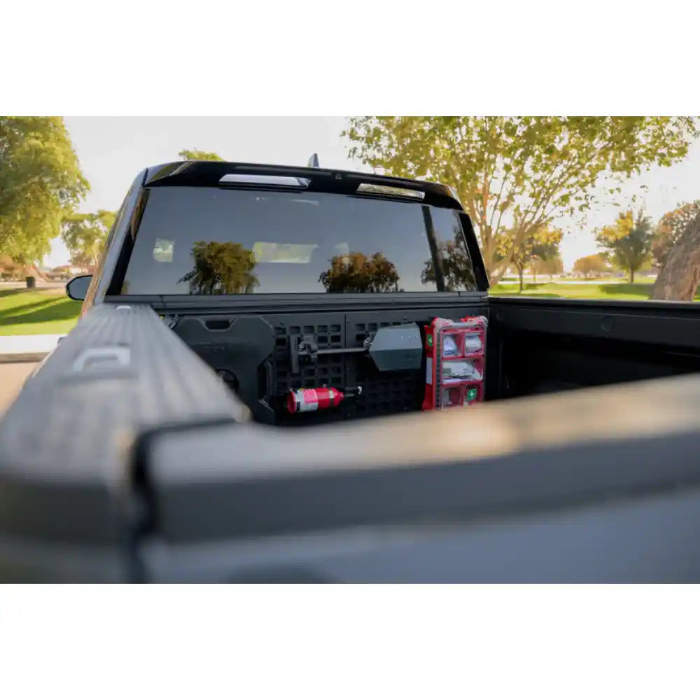 Rago Rivian bed cab Molle panel with gear mounted