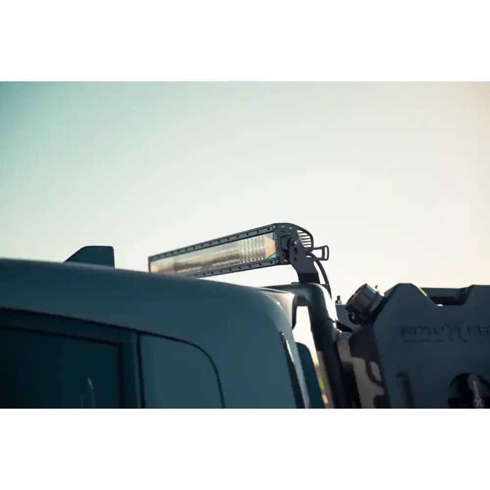 Rago chase rack behind Rivian R1T cab, side view