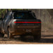 Rivian R1T with Rago chase rack off-road, rear view