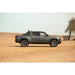 Rivian R1T with Rago chase rack, side profile in desert