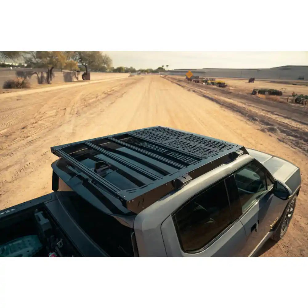 Rago decking panels on Rivian roof rack, elevated angle