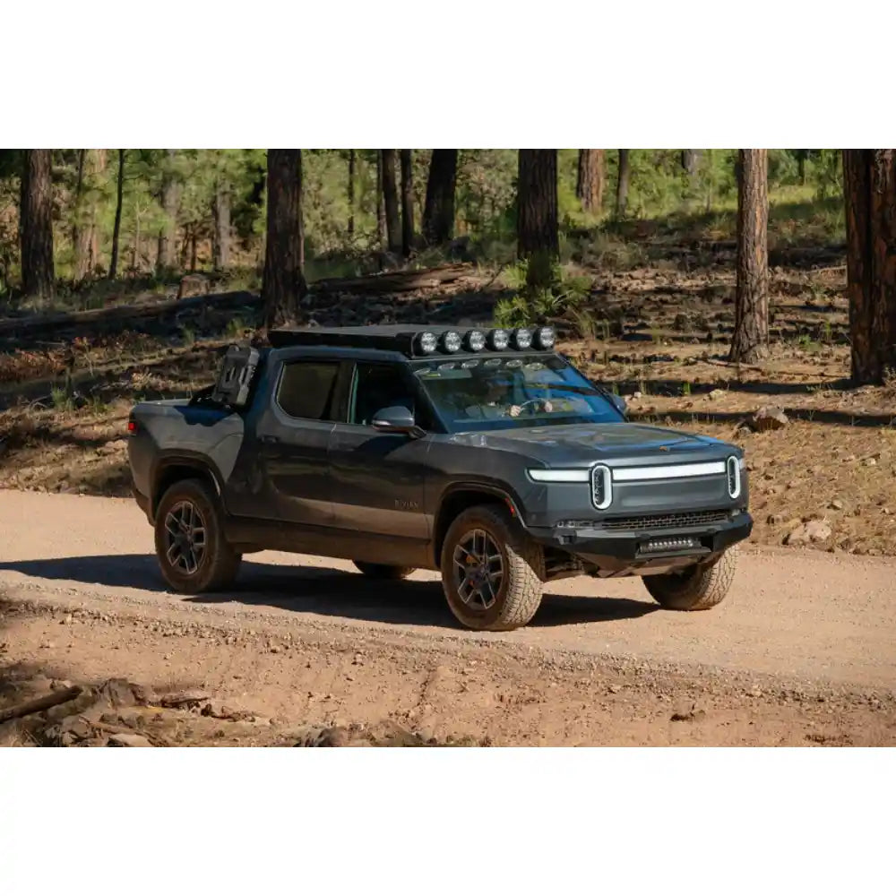 Rivian R1T with Rago roof rack and RIGID lights in forest