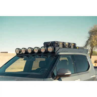 Six RIGID round lights on Rago Rivian R1T roof rack, front angle