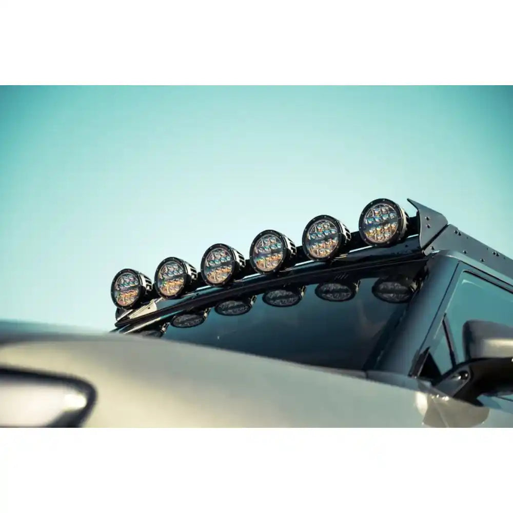 RIGID round lights on Rago Rivian roof rack, elevated front angle