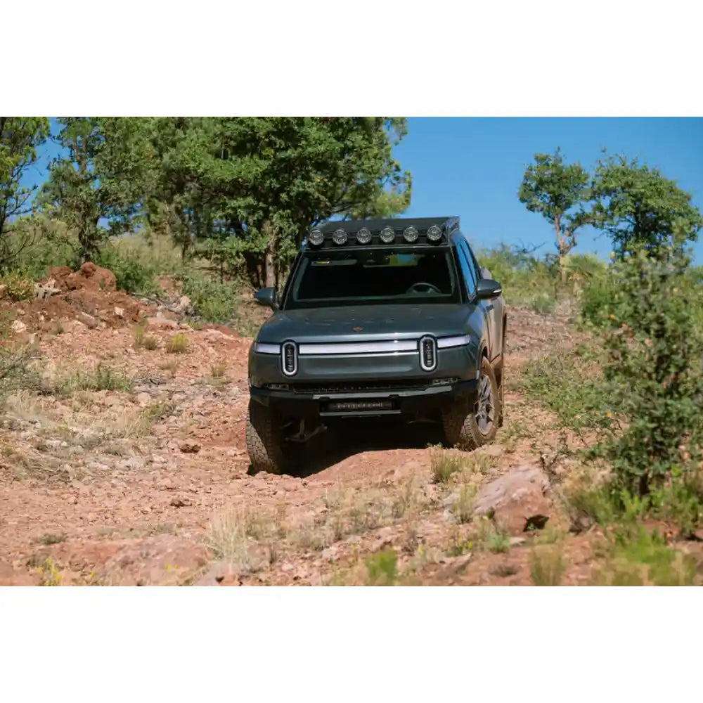 Rivian R1T with Rago roof rack on dirt trail