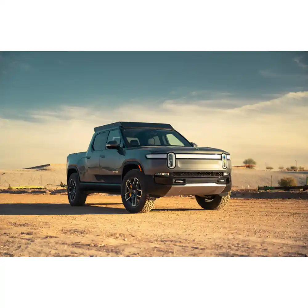 Rivian R1T with Rago roof rack, front view in desert