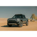 Rivian R1T with Rago light pocket roof rack, front view in desert