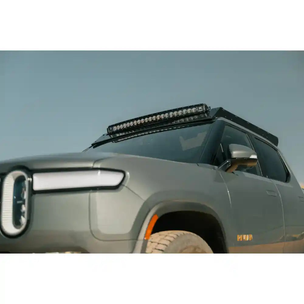 Rivian R1T with light bar in Rago roof rack, front view