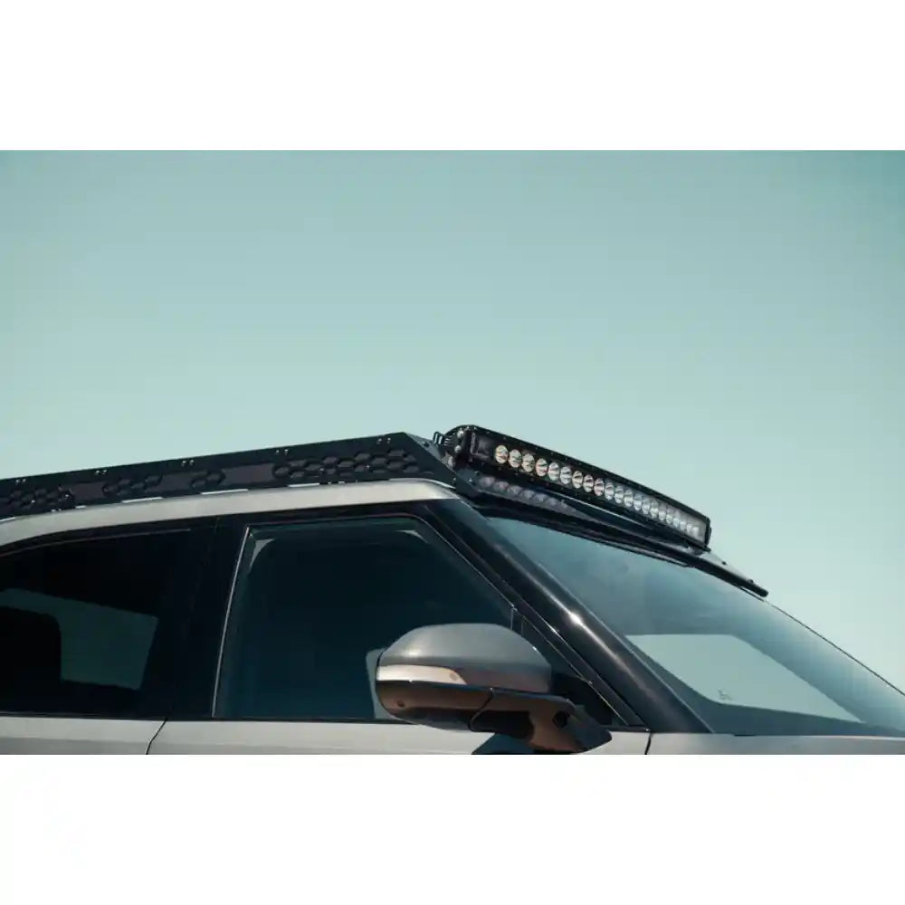 Rivian R1T with Rago roof rack, front three-quarter