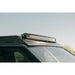 Light bar in Rago roof rack pocket on Rivian, low side angle
