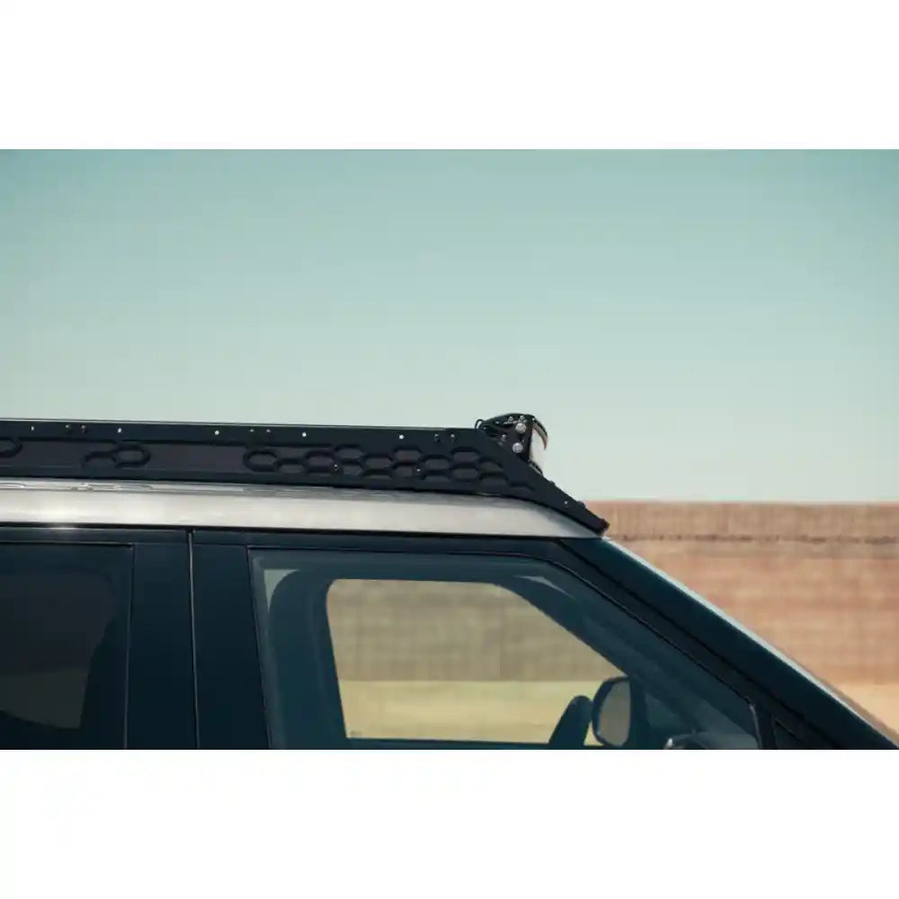 Rago roof rack over Rivian R1T windshield, side view