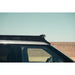 Rago roof rack over Rivian R1T windshield, side view